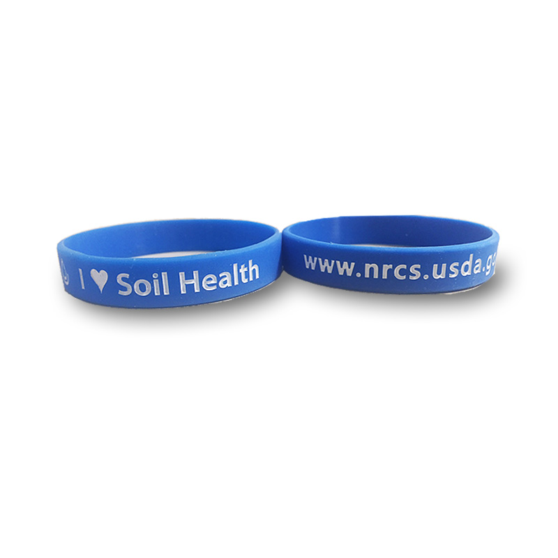 blue silicone wristbands with I heart soil health and NRCS url