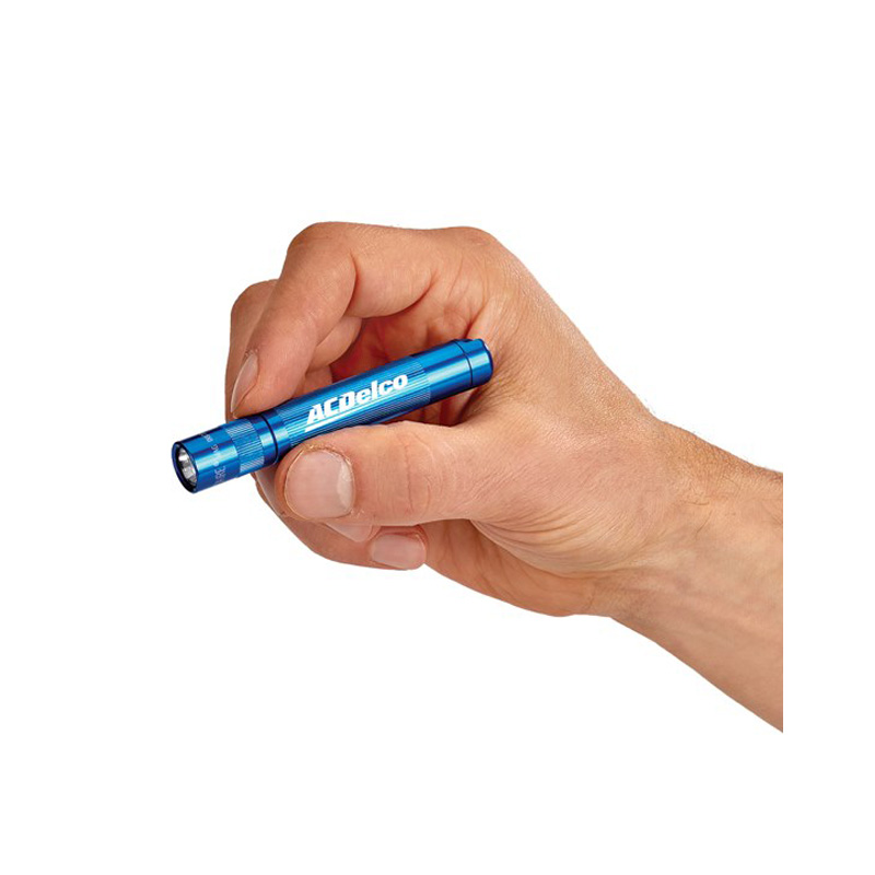 hand holding a small flashlight